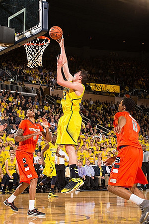 Ricky Doyle (32) and Caris LeVert (23)