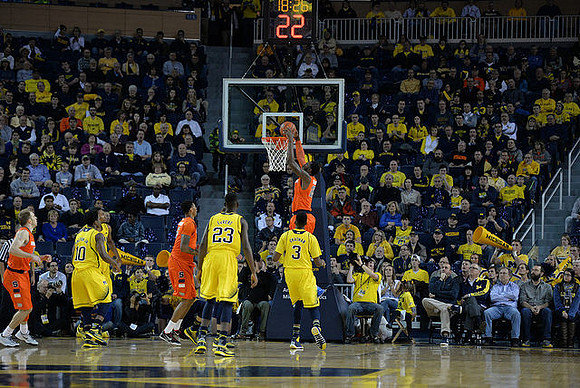 Derrick Walton Jr. (10), Caris LeVert (23), and Kameron Chatman (3)