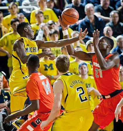 Caris LeVert (23) and Spike Albrecht (2)