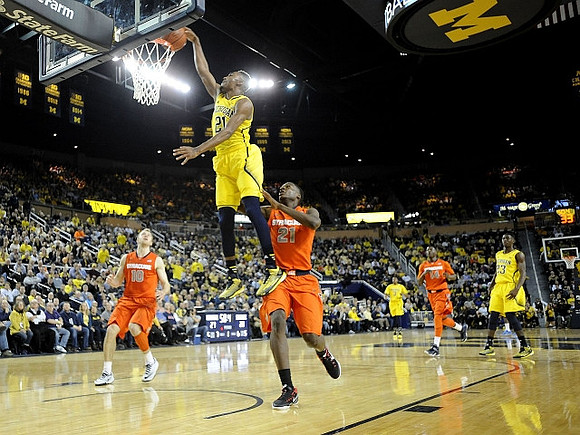 Zak Irvin (21), Caris LeVert (23), and Kameron Chatman (3)