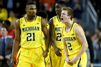 Zak Irvin (21), Caris LeVert (23), and Spike Albrecht (2)