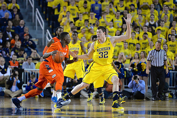 Caris LeVert (23) and Ricky Doyle (32)