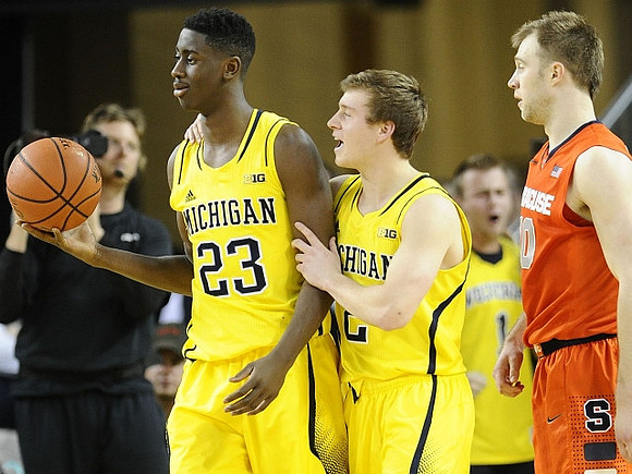 Caris LeVert (23) and Spike Albrecht (2)