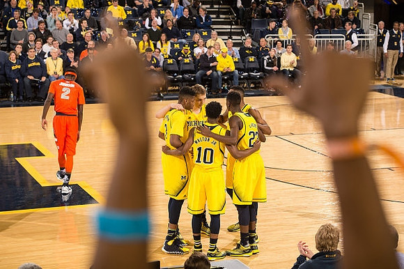 Mark Donnal (34), Kameron Chatman (3), Derrick Walton Jr. (10), Caris LeVert (23), and Zak Irvin (21)