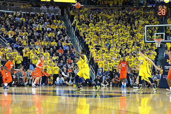 Kameron Chatman (3), Caris LeVert (23) and Mark Donnal (34)
