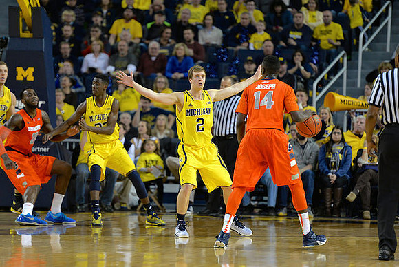 Caris LeVert (23) and Spike Albrecht (2)