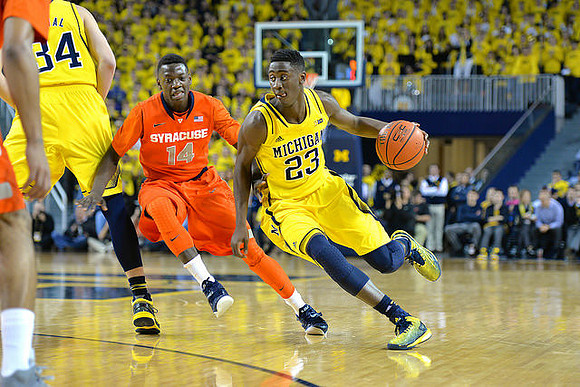 Mark Donnal (34) and Caris LeVert (23)