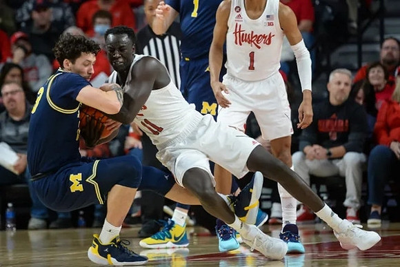 Brandon Johns Jr. (23) and Hunter Dickinson (1)