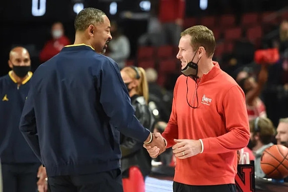 Saddi Washington, Juwan Howard, and Nebraska Head Coach Fred Hoiberg