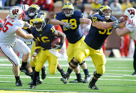 Denard Robinson (16), Patrick Omameh (65), Perry Dorrestein (79), and Stephen Schilling (52)