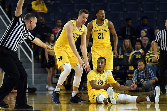 Duncan Robinson (22), Muhammad-Ali Abdur-Rahkman (12), and Zak Irvin (21)