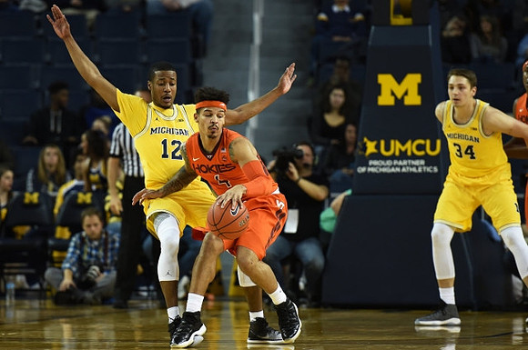 Muhammad-Ali Abdur-Rahkman (12) and Mark Donnal (34)