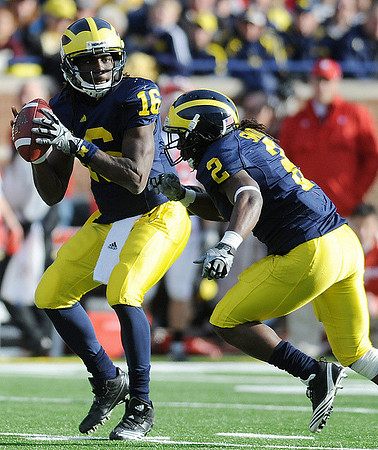 Denard Robinson (16) and Vincent Smith (2)