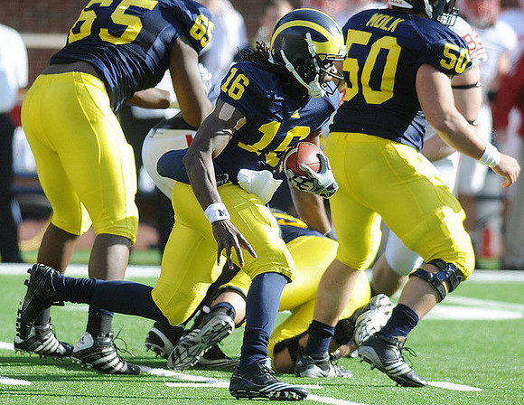 Patrick Omameh (65), Denard Robinson (16), and David Molk (50)