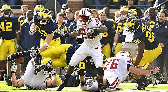 J.B. Fitzgerald (42), Jordan Kovacs (32), Adam Patterson (99), and Kenny Demens (25)
