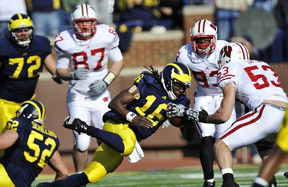 Mark Huyge (72), Stephen Schilling (52), and Denard Robinson (16)