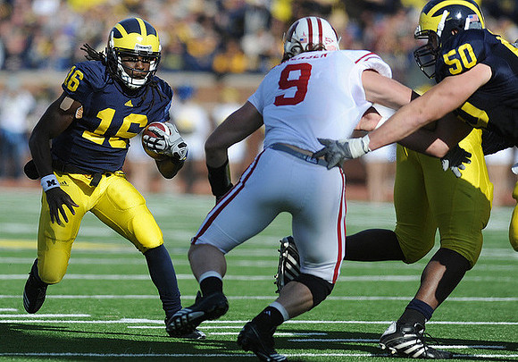Denard Robinson (16) and David Molk (50)