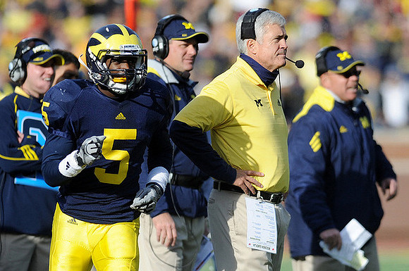 Courtney Avery (5), Rich Rodriguez, and Greg Robinson
