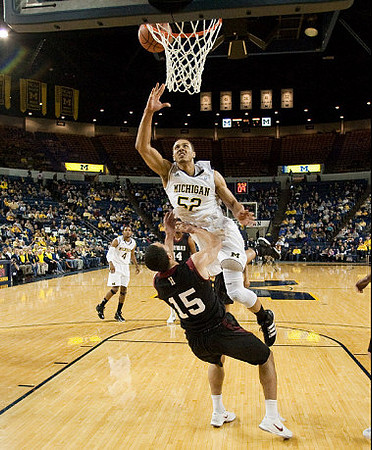 Jordan Morgan (52) and Darius Morris (4)
