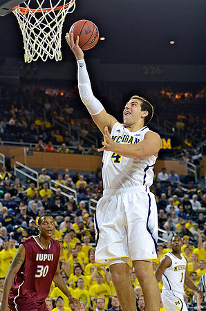 Mitch McGary (4) and Glenn Robinson III (1)