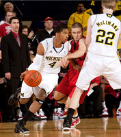 Ben Limback, Darius Morris (4), and Blake McLimans (22)