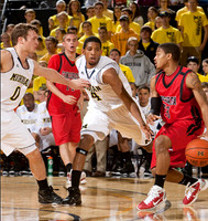Zack Novak (0) and Darius Morris (4)