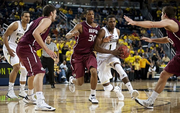 Glenn Robinson III (1) and Jordan Morgan (52)