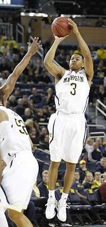 Jordan Morgan (52) and Trey Burke (3)