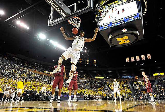 Glenn Robinson III (1) and Jordan Morgan (52)