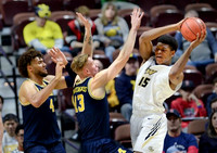 Jordan Poole (2) and Brandon Johns Jr. (23)