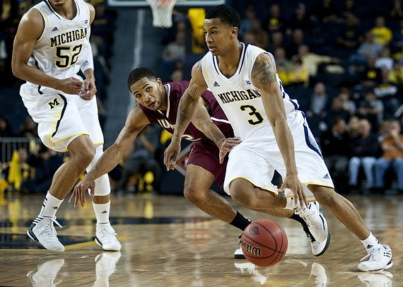 Trey Burke (3) and Jordan Morgan (52)