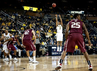 Trey Burke (3) and Jordan Morgan (52)
