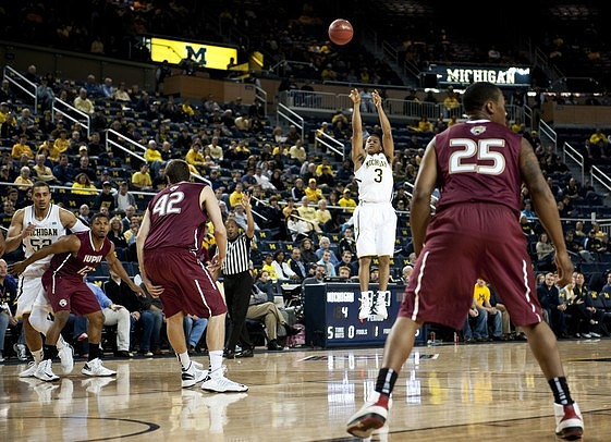 Trey Burke (3) and Jordan Morgan (52)