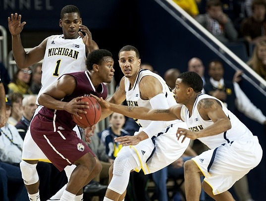 Glenn Robinson III (1), Jordan Morgan (52), and Trey Burke (3)