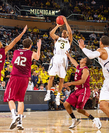 Trey Burke (3) and Jordan Morgan (52)
