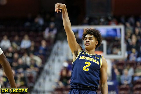 Zavier Simpson (3), Isaiah Livers (4), Charles Matthews (1), Jordan Poole (2), and Jon Teske (15)