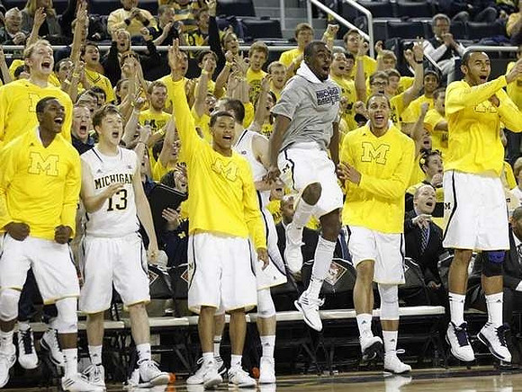 Blake McLimans (22), Caris LeVert (23), Matt Vogrich (13), Trey Burke (3), Nik Stauskas (11), Tim Hardaway Jr. (10), Jordan Morgan (52), and Jon Horford (15)