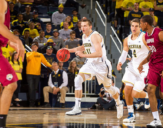Nik Stauskas (11) and Mitch McGary (4)