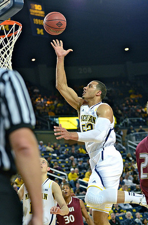 Nik Stauskas (11) and Jordan Morgan (52)
