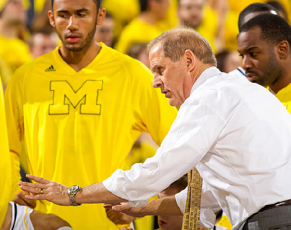 Jon Horford (15), John Beilein, and Eso Akunne (5)