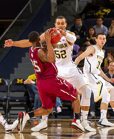 Jordan Morgan (52) and Nik Stauskas (11)