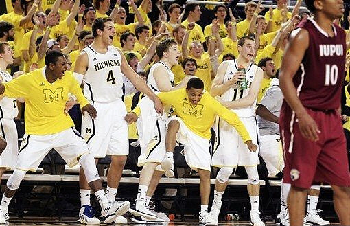 Spike Albrecht (2), Caris LeVert (23), Mitch McGary (4), Matt Vogrich (13), Trey Burke (3), and Nik Stauskas (11)