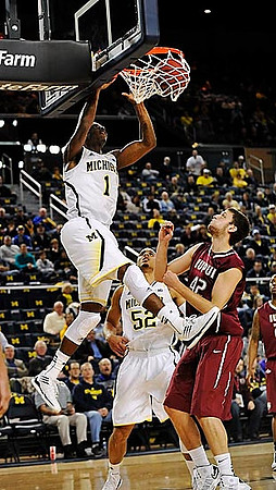 Glenn Robinson III (1) and Jordan Morgan (52)