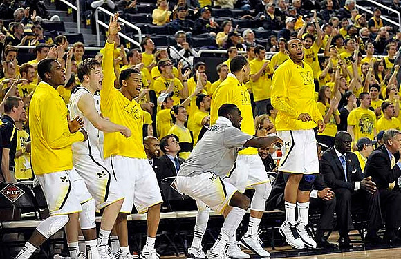 Caris LeVert (23), Matt Vogrich (13), Trey Burke (3), Tim Hardaway Jr. (10), Jordan Morgan (52), and Jon Horford (15)