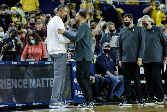 Juwan Howard and Minnesota Head Coach Ben Johnson