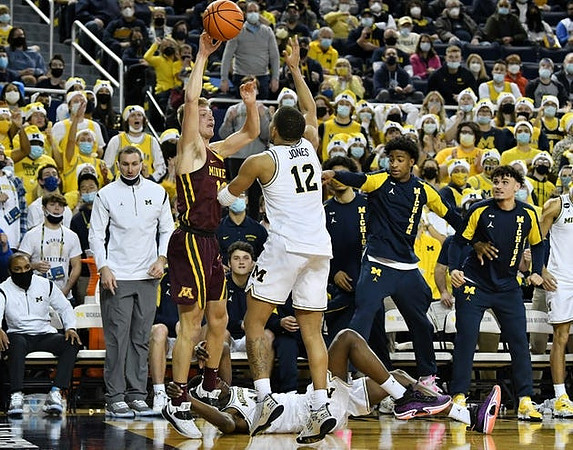 DeVante' Jones (12) and Moussa Diabate (14)