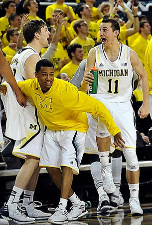 Matt Vogrich (13), Trey Burke (3), and Nik Stauskas (11)