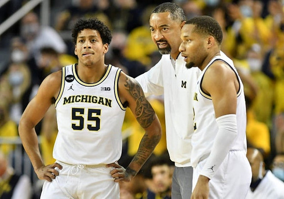 Eli Brooks (55), Juwan Howard, and DeVante' Jones (12)