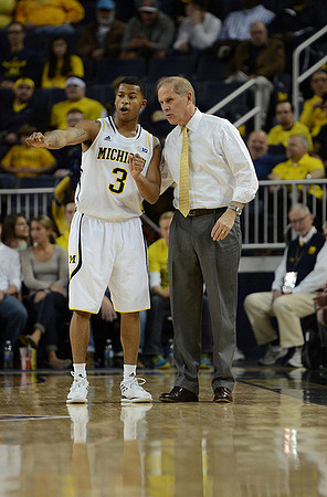 Trey Burke (3) and John Beilein