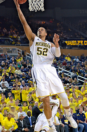 Jordan Morgan (52) and Glenn Robinson III (1)
